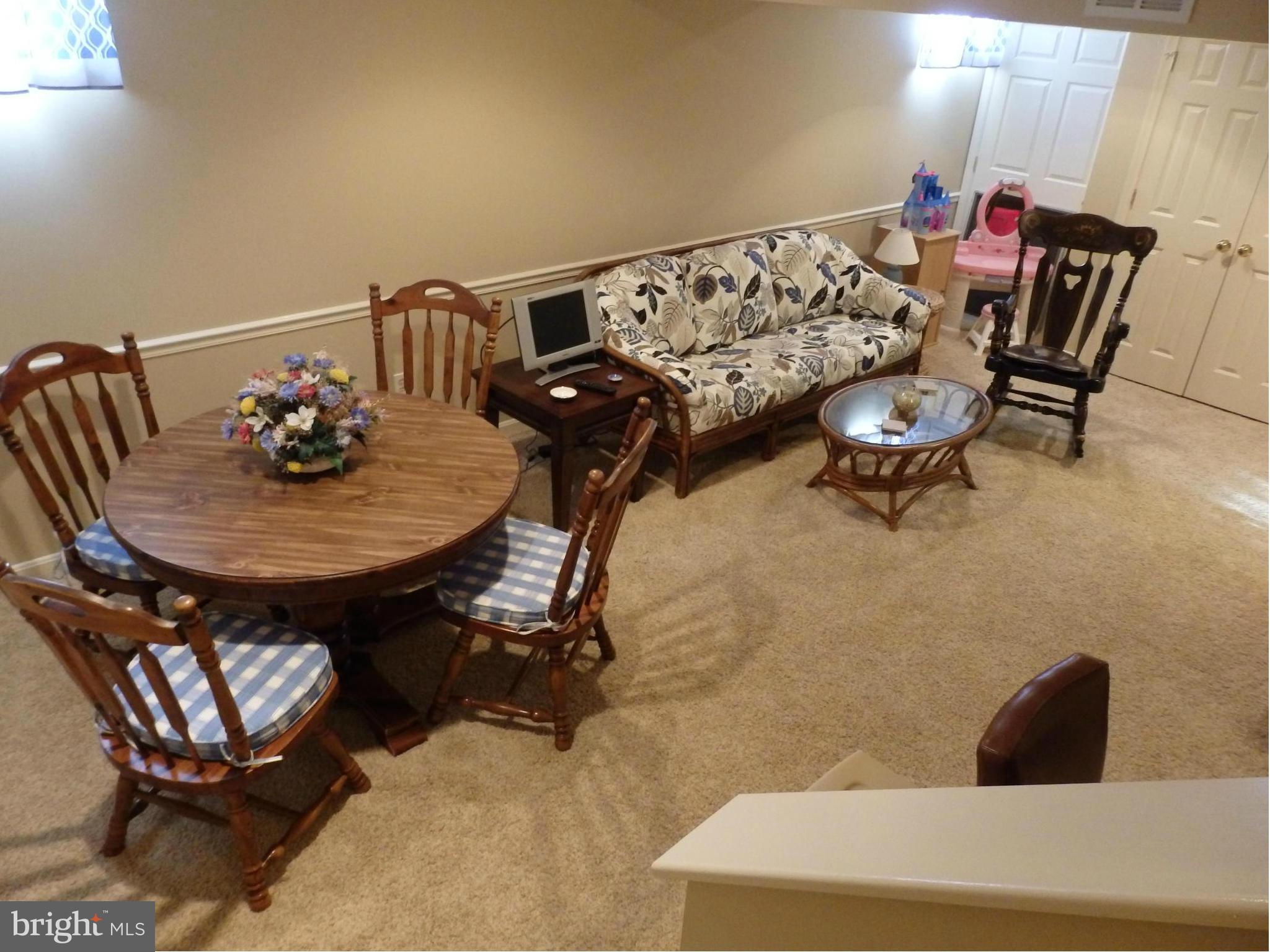 2236 Bear Den Road Frederick, MD 21701 - Photo 22 of 30 a living room with furniture and a wooden floor