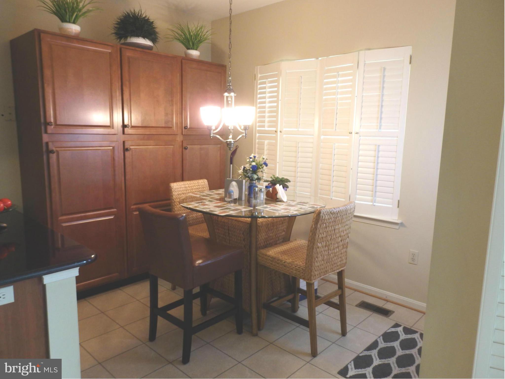 2236 Bear Den Road Frederick, MD 21701 - Photo 8 of 30 a kitchen with a table and chairs