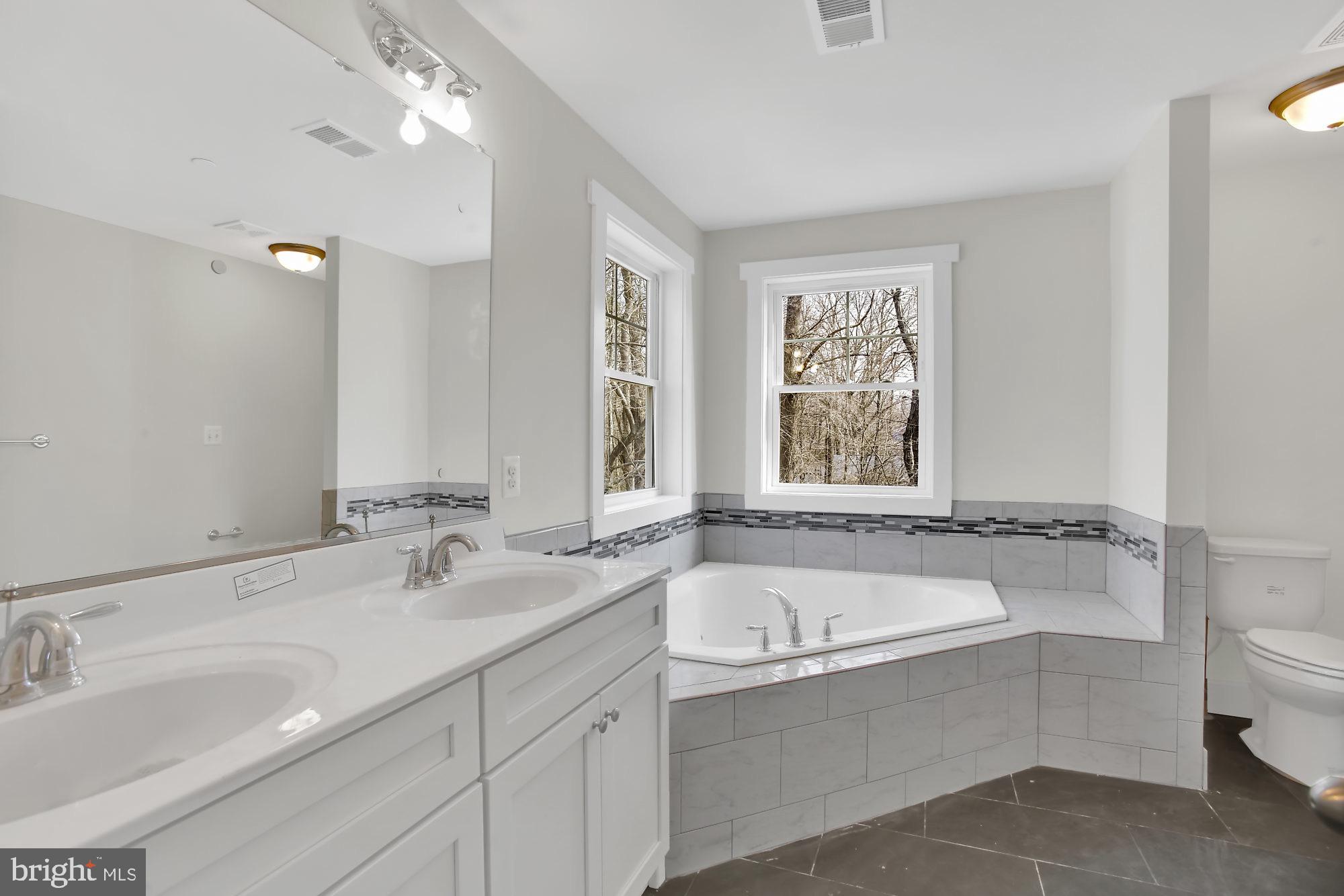 608 Powhatan Beach Road Pasadena, MD 21122 - Photo 8 of 28 Master bath with double vanity and soaking tub