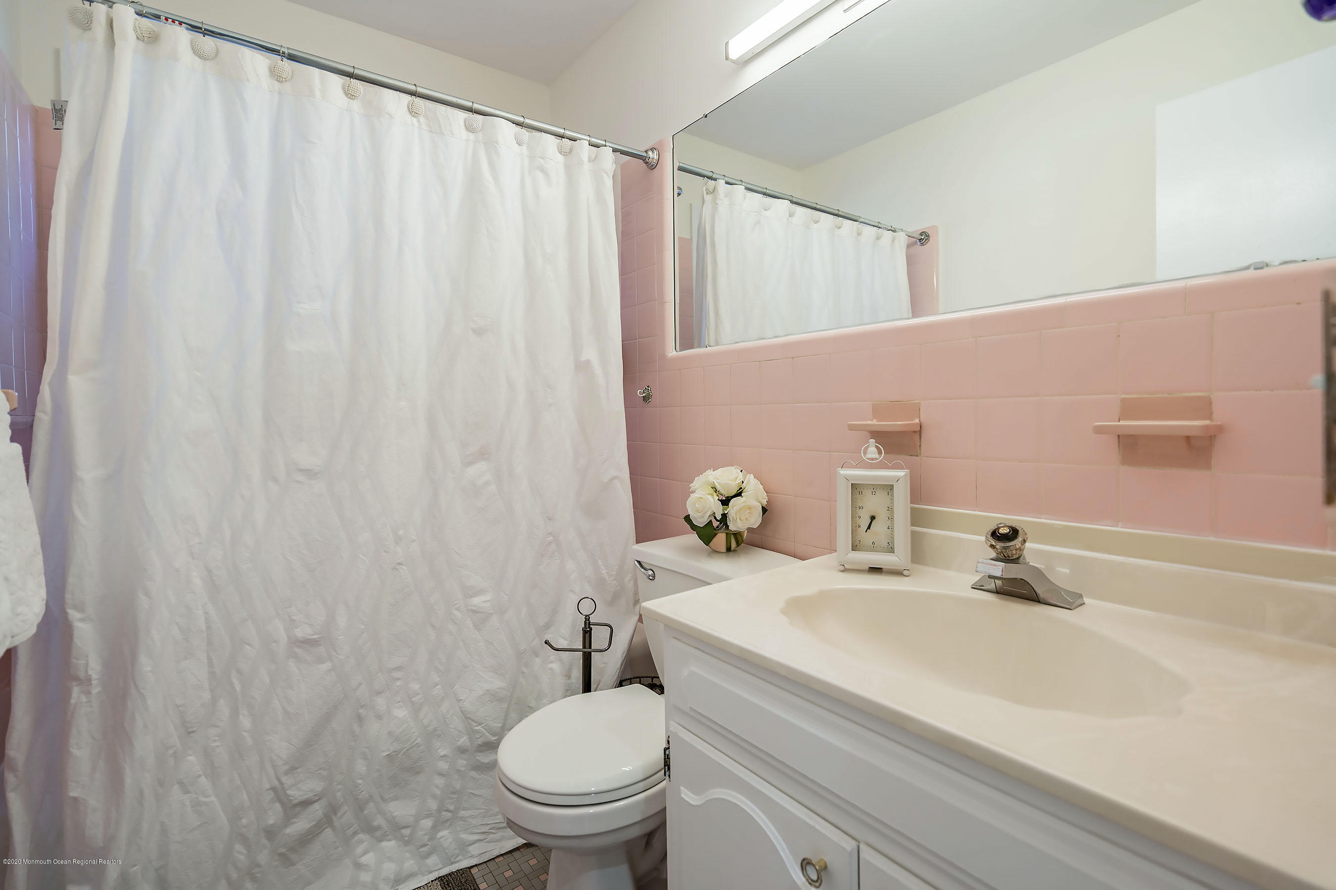 210 Pinckney Road Little Silver, NJ 07739 - Photo 17 of 28 a bathroom with a sink a toilet and a mirror
