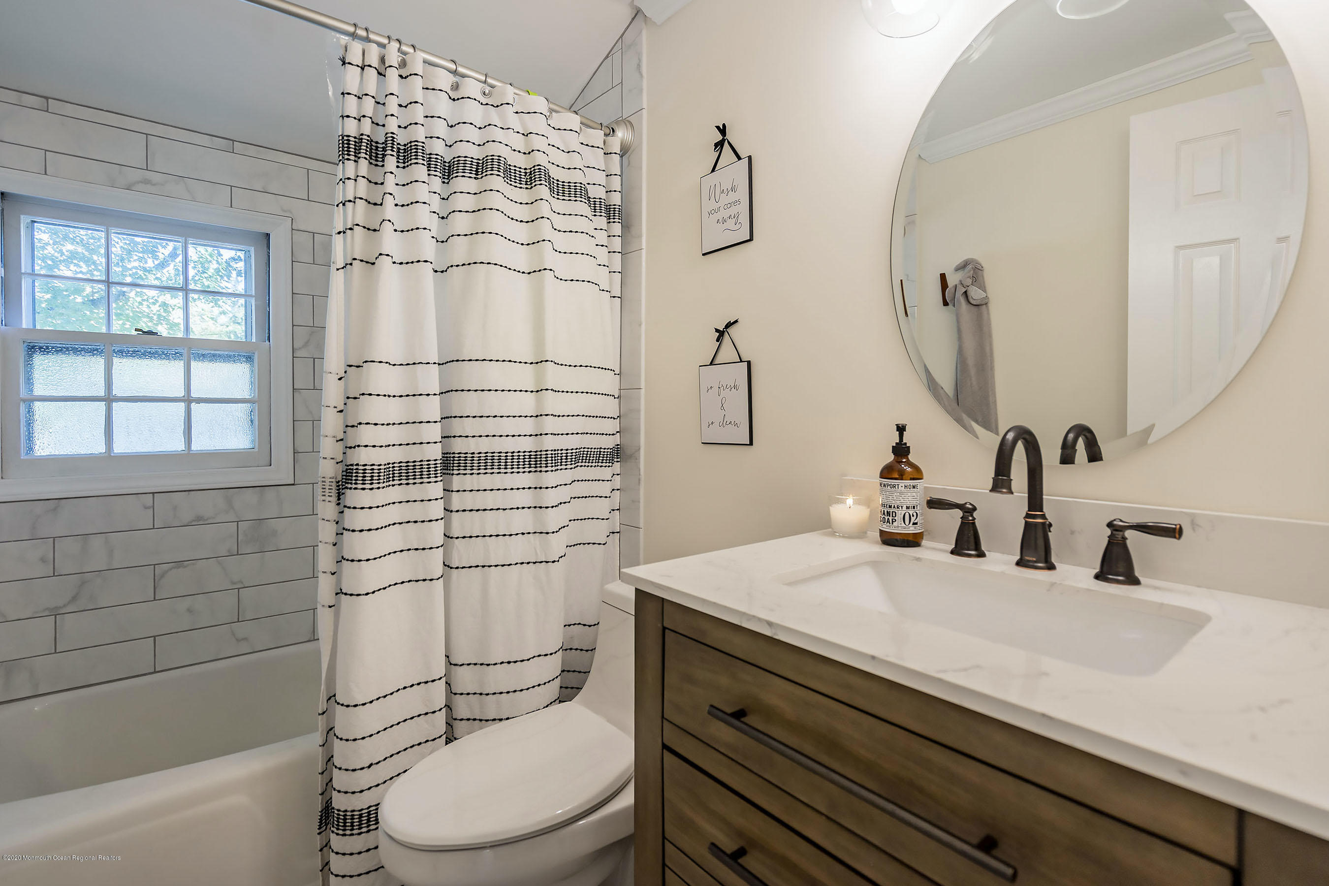 210 Pinckney Road Little Silver, NJ 07739 - Photo 20 of 28 a bathroom with a sink a toilet and shower