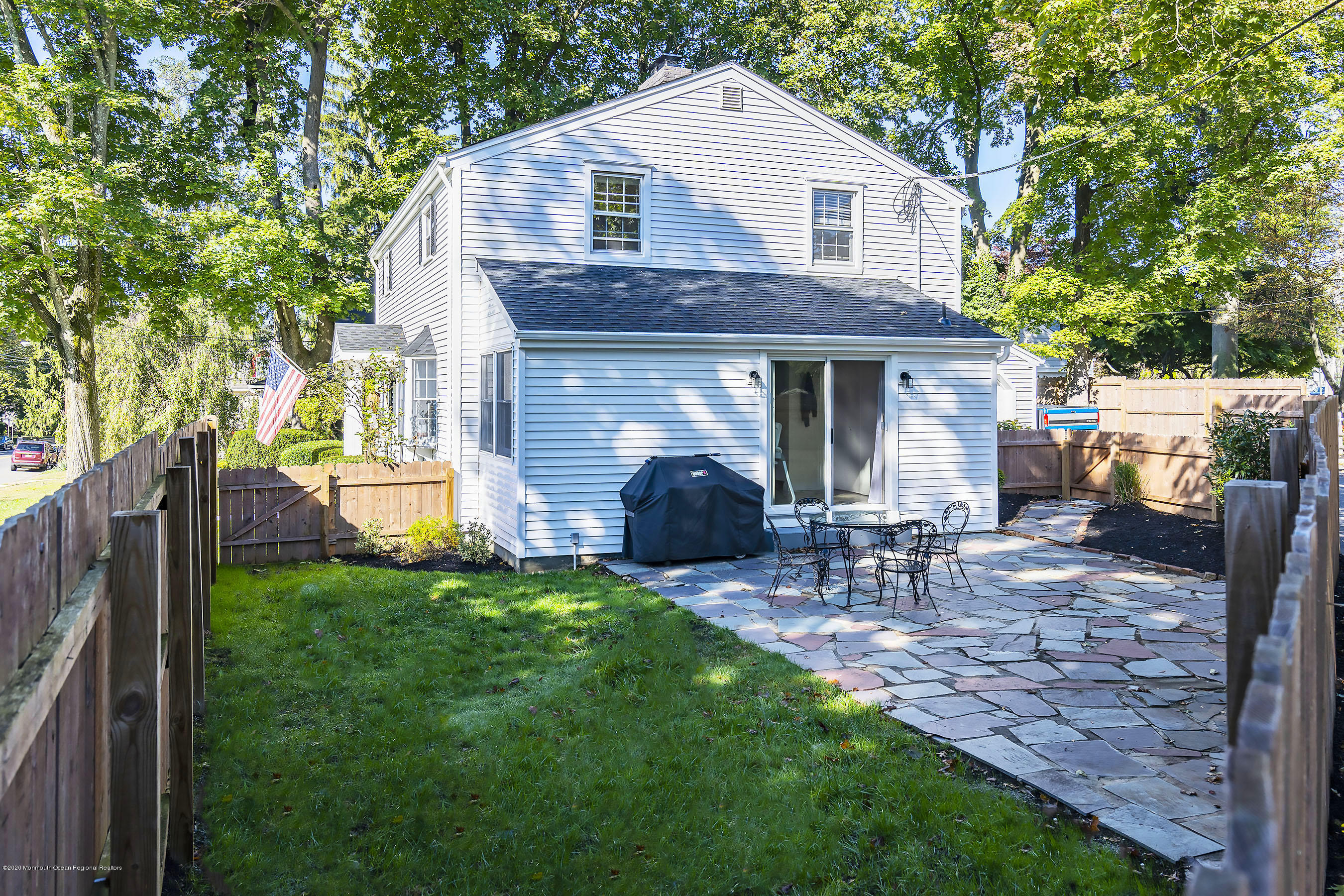 210 Pinckney Road Little Silver, NJ 07739 - Photo 25 of 28 a view of a house with a yard and chairs