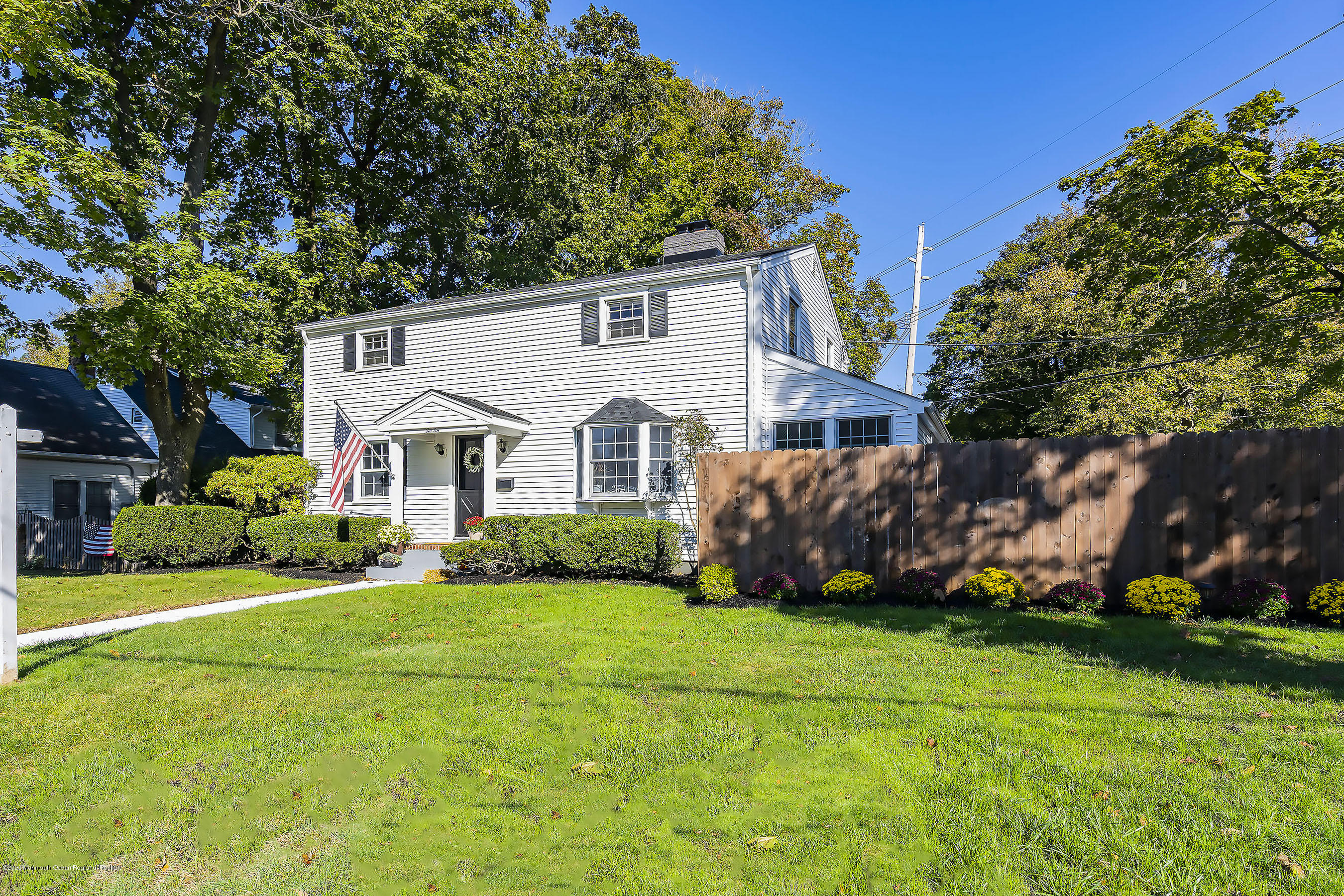 210 Pinckney Road Little Silver, NJ 07739 - Photo 4 of 28 a view of a white house with garden and yard
