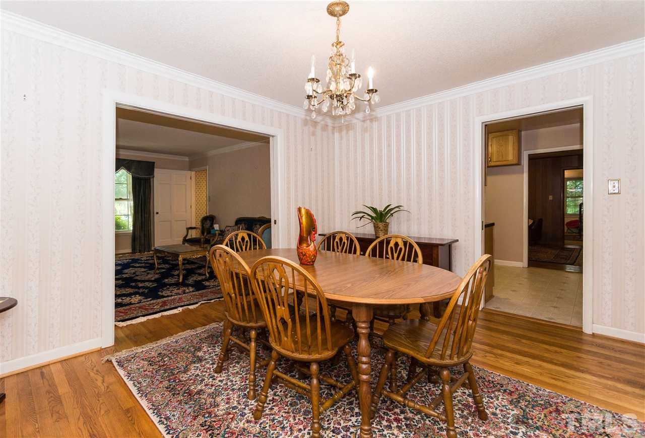 1926 Highland Place Raleigh, NC 27607 - Photo 4 of 23 a view of a dining room with furniture and wooden floor