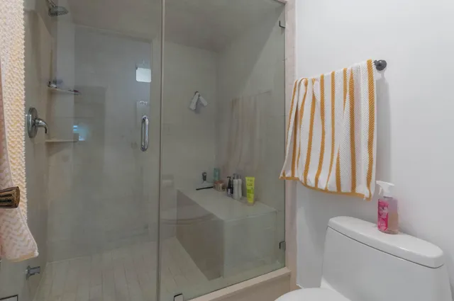 a bathroom with a bathtub and shower
