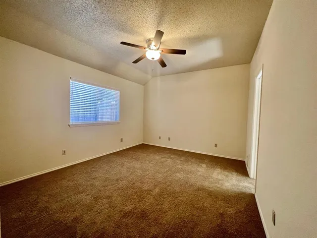a view of a big room with carpet
