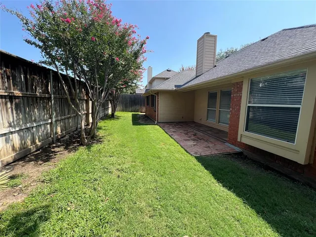 a view of a backyard of the house