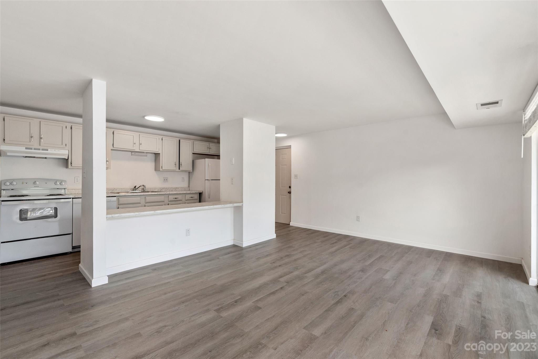 9333 Old Concord Road, Unit J Charlotte, NC 28213 - Photo 6 of 17 a view of kitchen with wooden floor