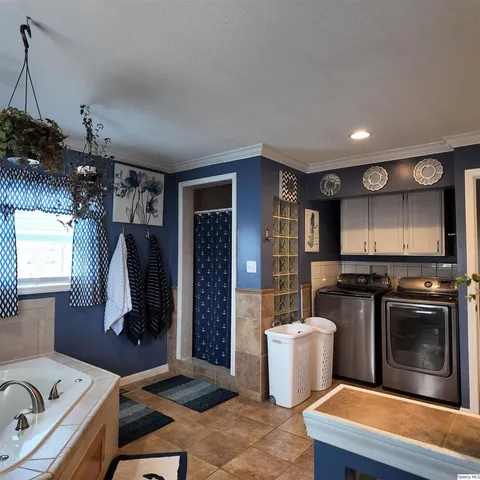 a kitchen with a refrigerator and a sink