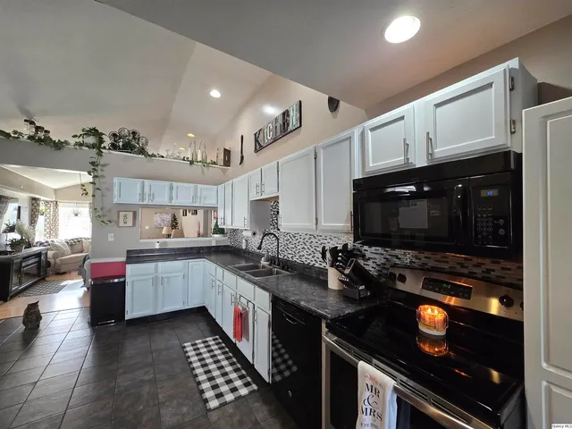 a kitchen with lots of counter top space and appliances