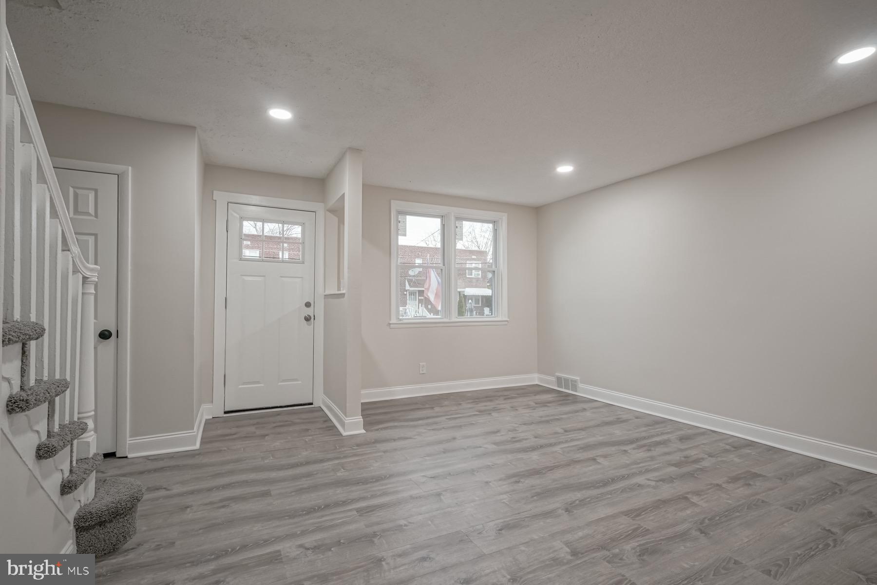 2863 Cushing Road Camden, NJ 08104 - Photo 3 of 33 wooden floor in an empty room with a window