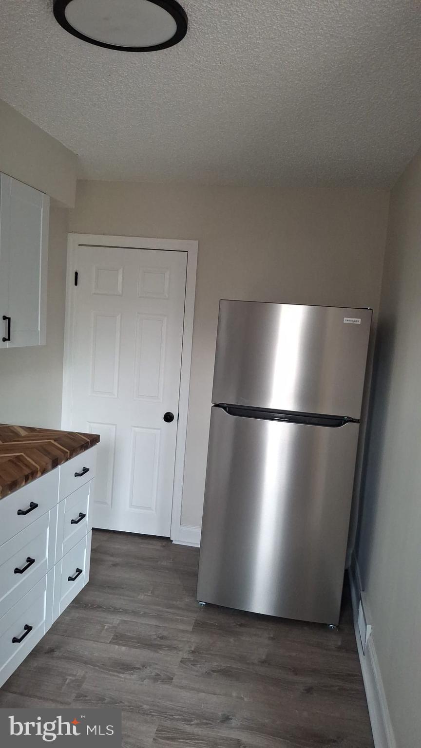 2863 Cushing Road Camden, NJ 08104 - Photo 6 of 33 a view of kitchen with wooden floor