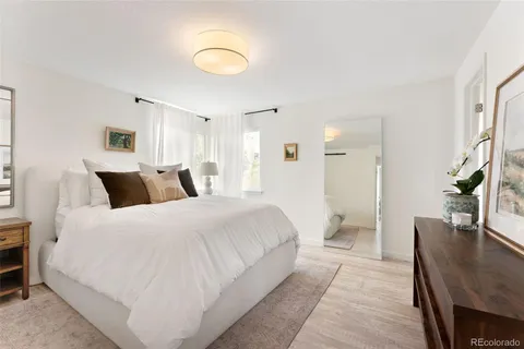 a large white bed in a white room