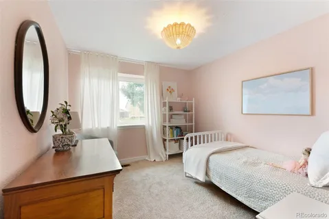 a bedroom with a bed and a table in it