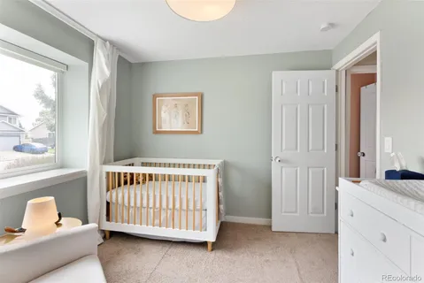 a bedroom with windows