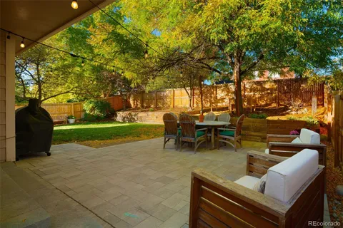 a view of a two chairs in a patio