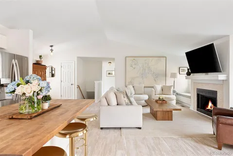 a living room with furniture fireplace and a flat screen tv
