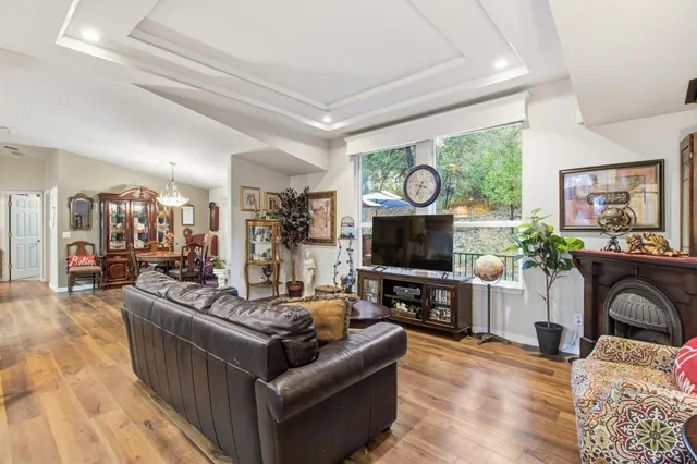 a kitchen with stainless steel appliances kitchen island granite countertop a table and chairs in it