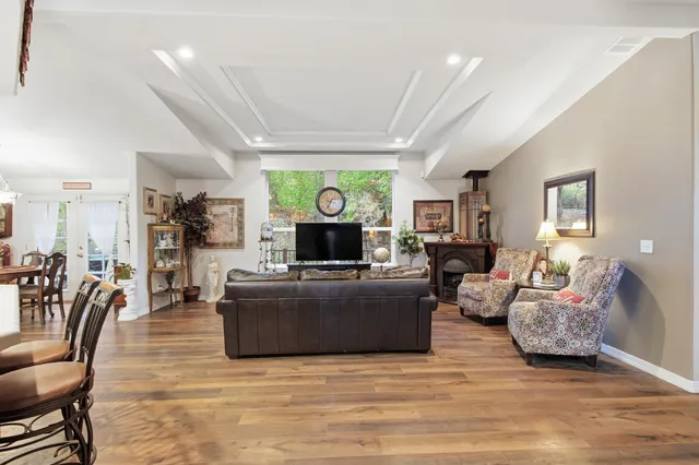 a kitchen with stainless steel appliances kitchen island granite countertop a refrigerator and a stove