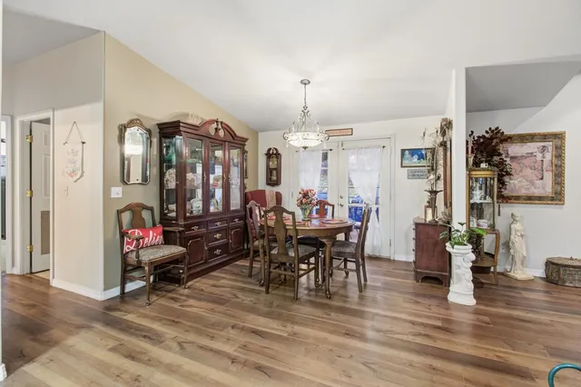 a bed room with a bed and a chandelier