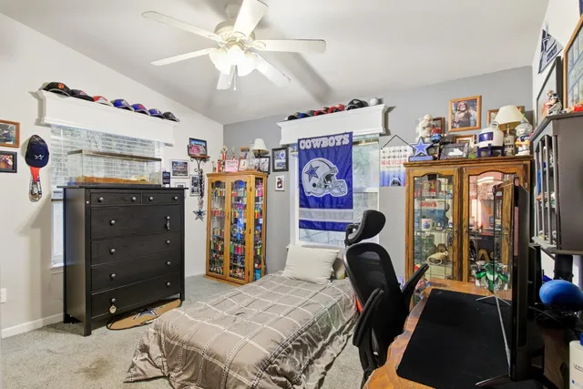 a backyard of a house with barbeque oven