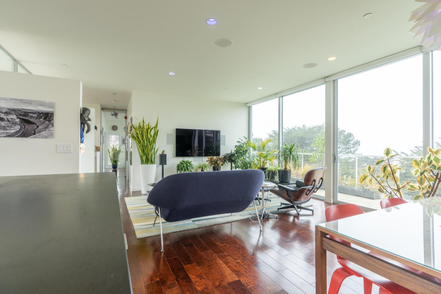 451 Talbot Avenue Pacifica, CA 94044 - Photo 11 of 38 a living room with furniture a flat screen tv and a large window