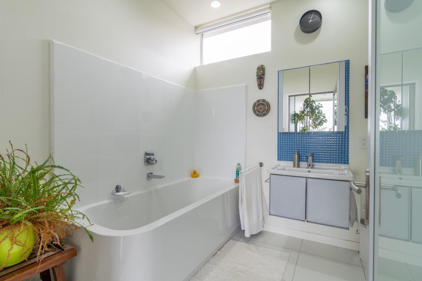 451 Talbot Avenue Pacifica, CA 94044 - Photo 17 of 38 a bathroom with a bathtub a sink and a window