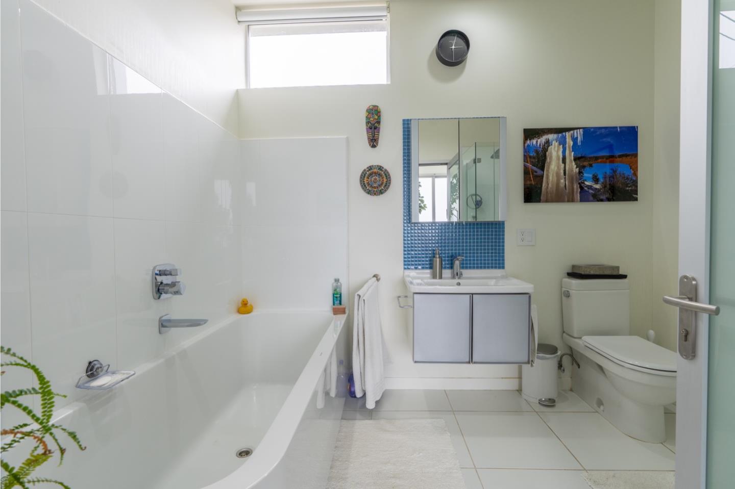 451 Talbot Avenue Pacifica, CA 94044 - Photo 18 of 38 a bathroom with a bathtub sink mirror vanity and toilet