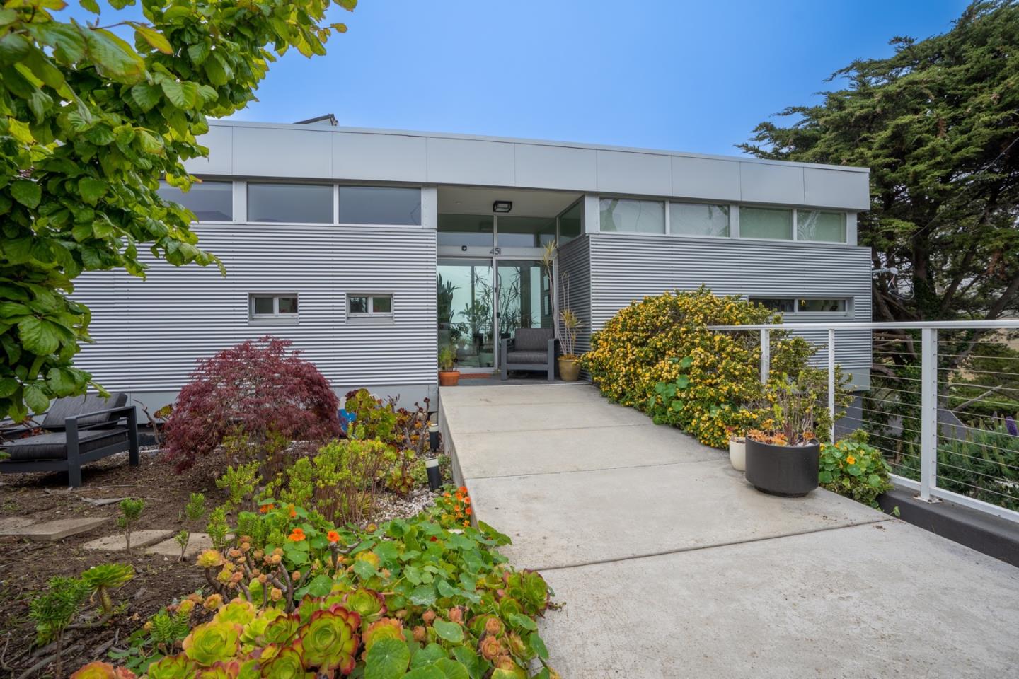 451 Talbot Avenue Pacifica, CA 94044 - Photo 2 of 38 a front view of a house with garden