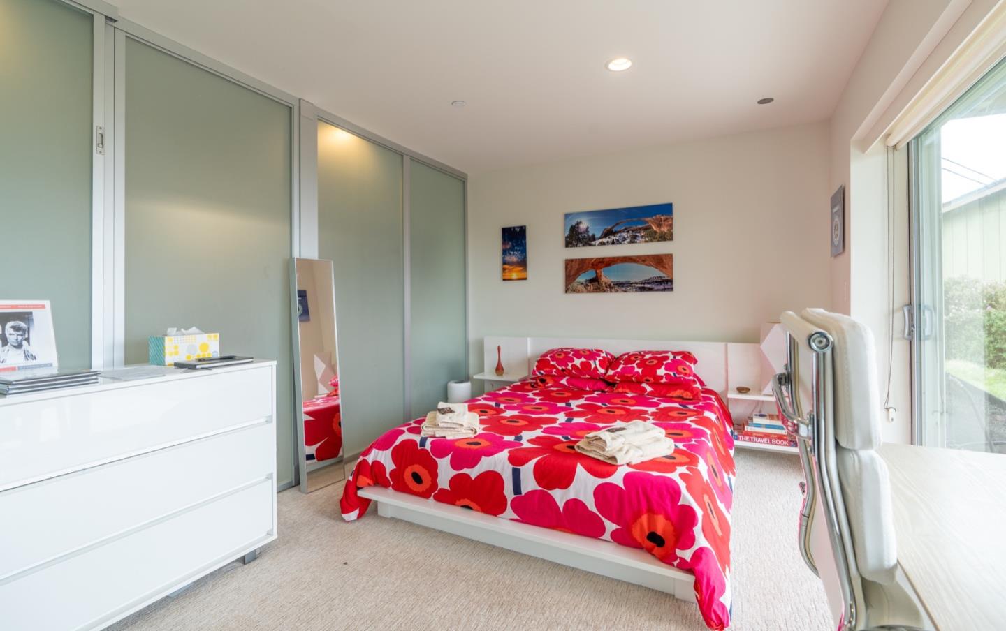 451 Talbot Avenue Pacifica, CA 94044 - Photo 21 of 38 a bedroom with a bed and a painting on the wall