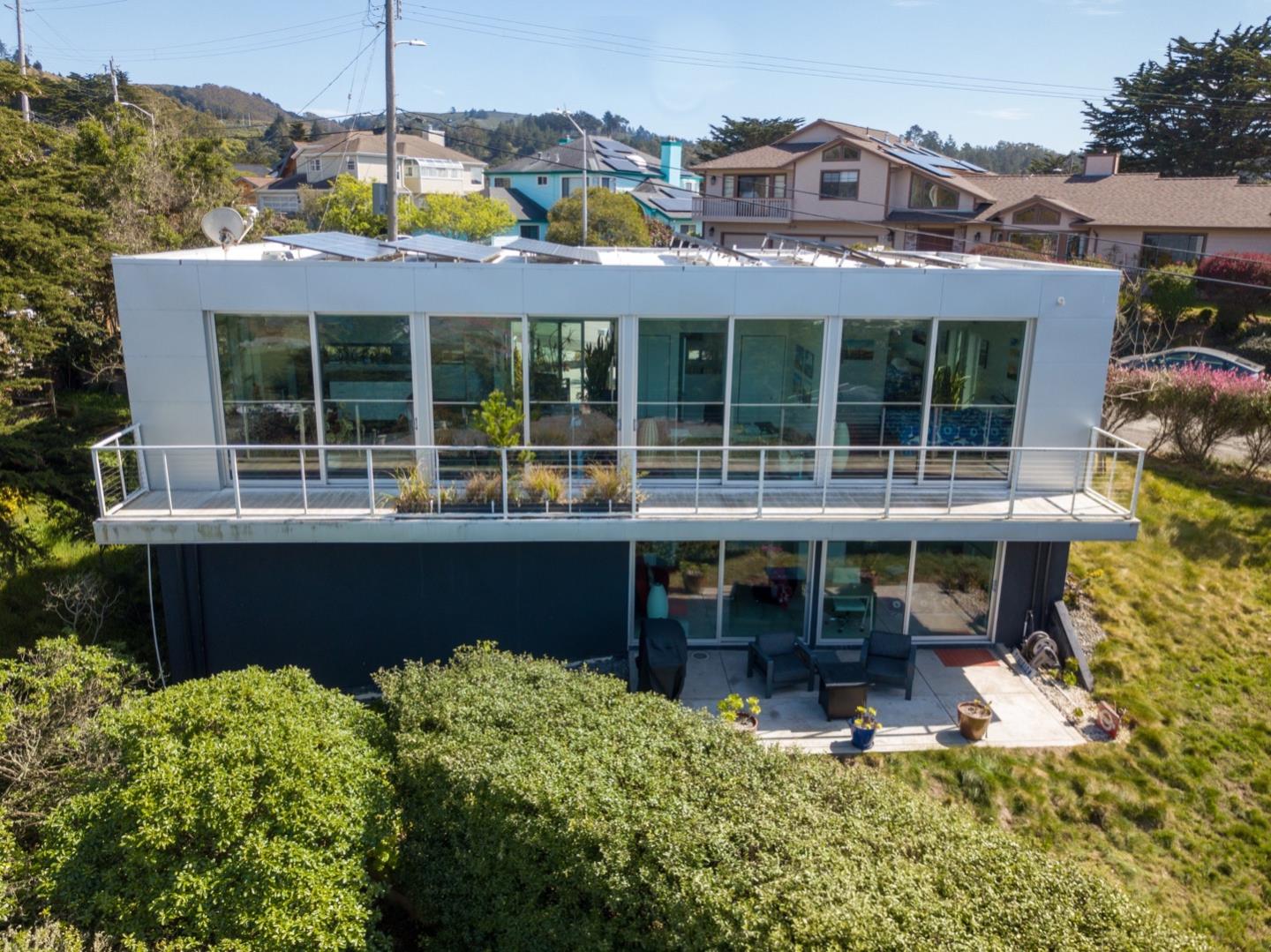 451 Talbot Avenue Pacifica, CA 94044 - Photo 27 of 38 a front view of a house with a large window and table