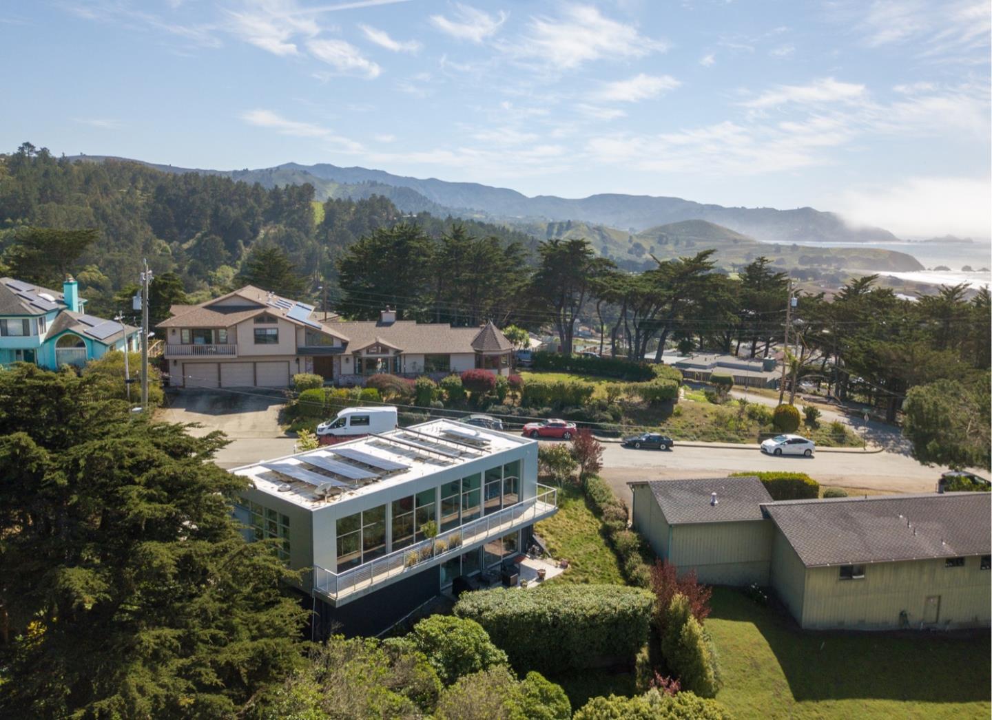 451 Talbot Avenue Pacifica, CA 94044 - Photo 29 of 38 a view of a house with a garden and mountains