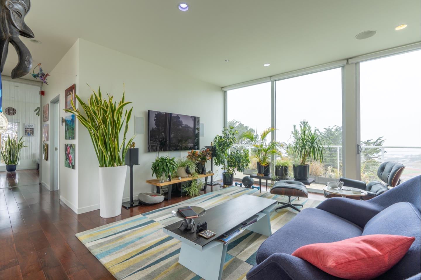 451 Talbot Avenue Pacifica, CA 94044 - Photo 5 of 38 a living room with furniture a large window and a wooden floor