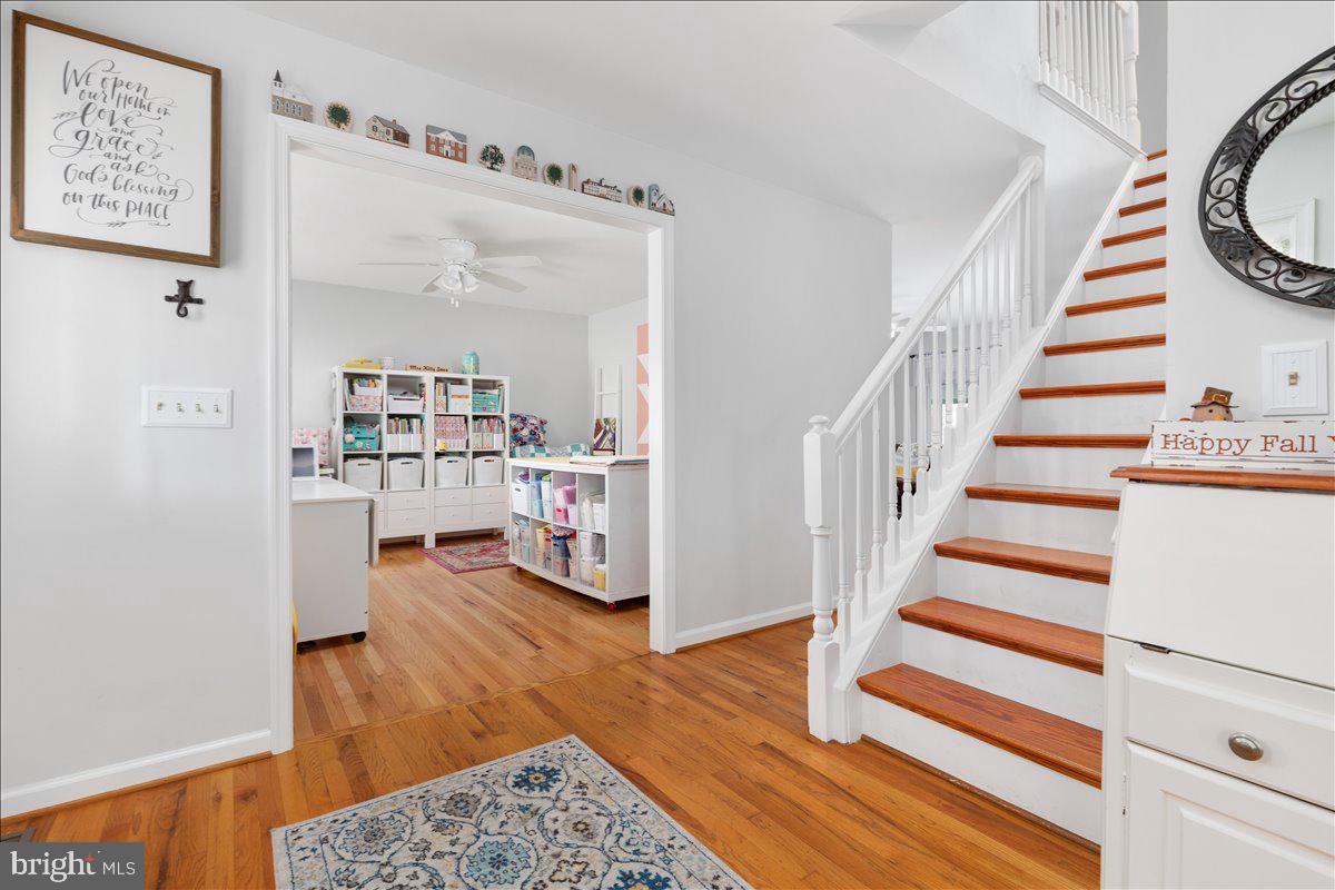 129 Old Wagon Road Winchester, VA 22602 - Photo 12 of 59 a view of a hallway with wooden floor and furniture