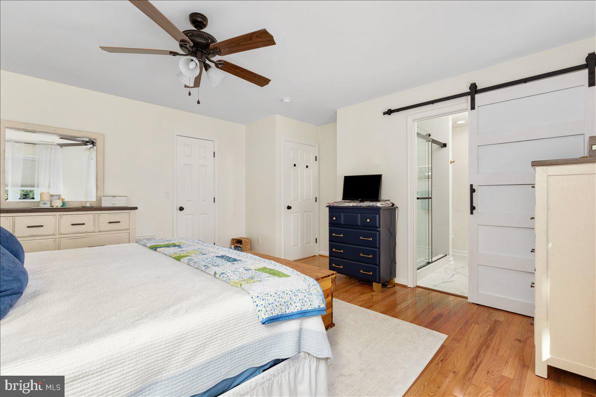 129 Old Wagon Road Winchester, VA 22602 - Photo 18 of 59 a bedroom with a bed and a flat screen tv