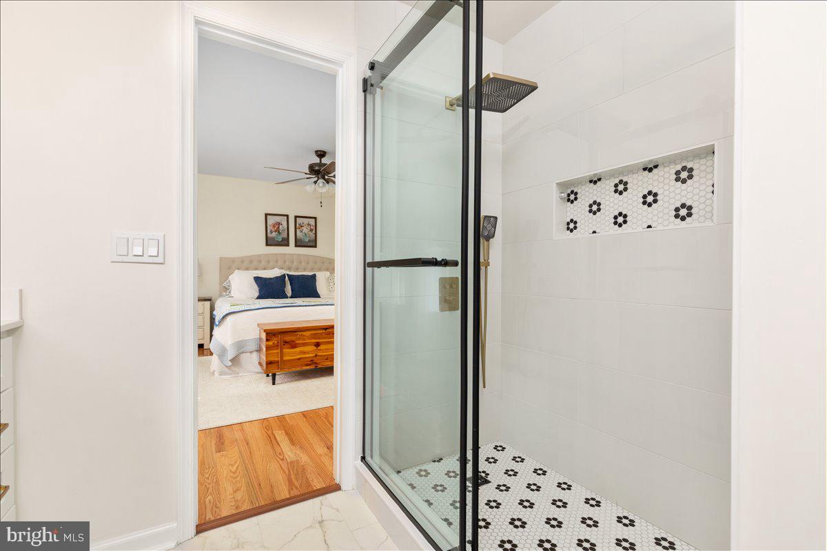 129 Old Wagon Road Winchester, VA 22602 - Photo 20 of 59 a walk in closet with wooden floor in a bathroom