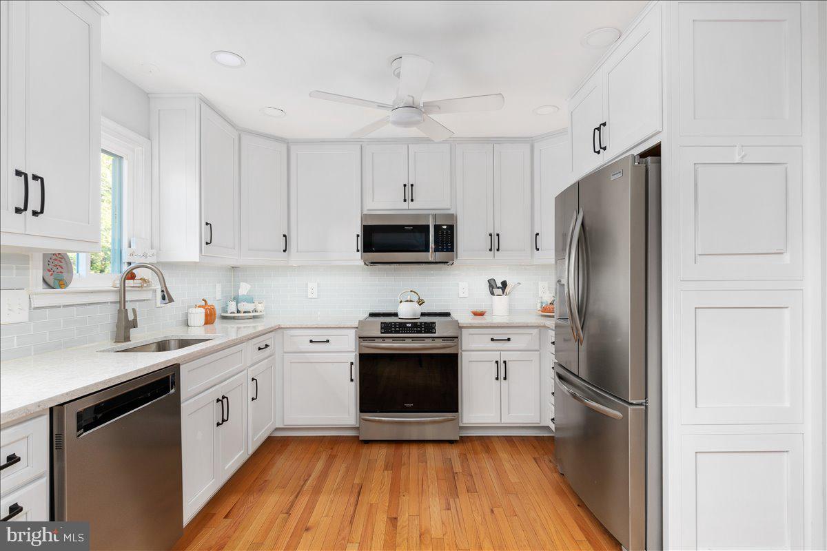 129 Old Wagon Road Winchester, VA 22602 - Photo 2 of 59 a kitchen with a stove sink and refrigerator