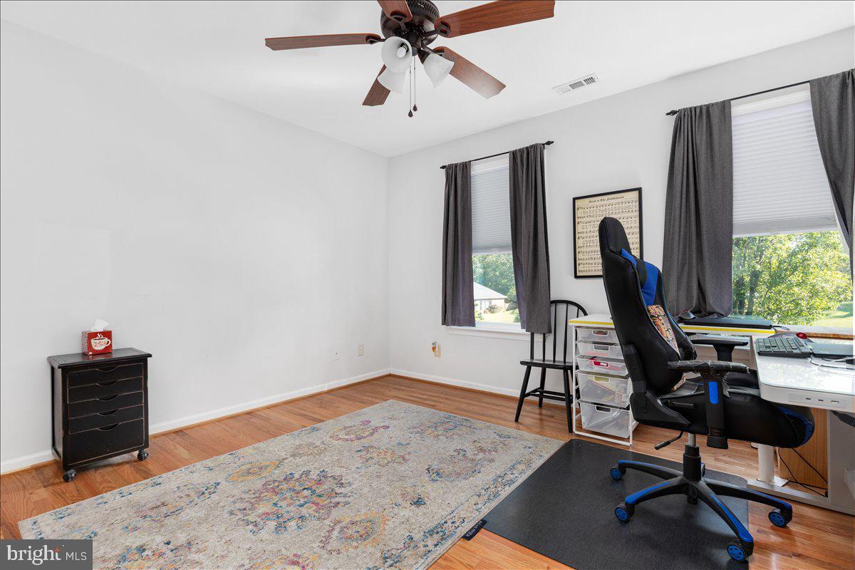 129 Old Wagon Road Winchester, VA 22602 - Photo 21 of 59 a view of a workspace with furniture and a window