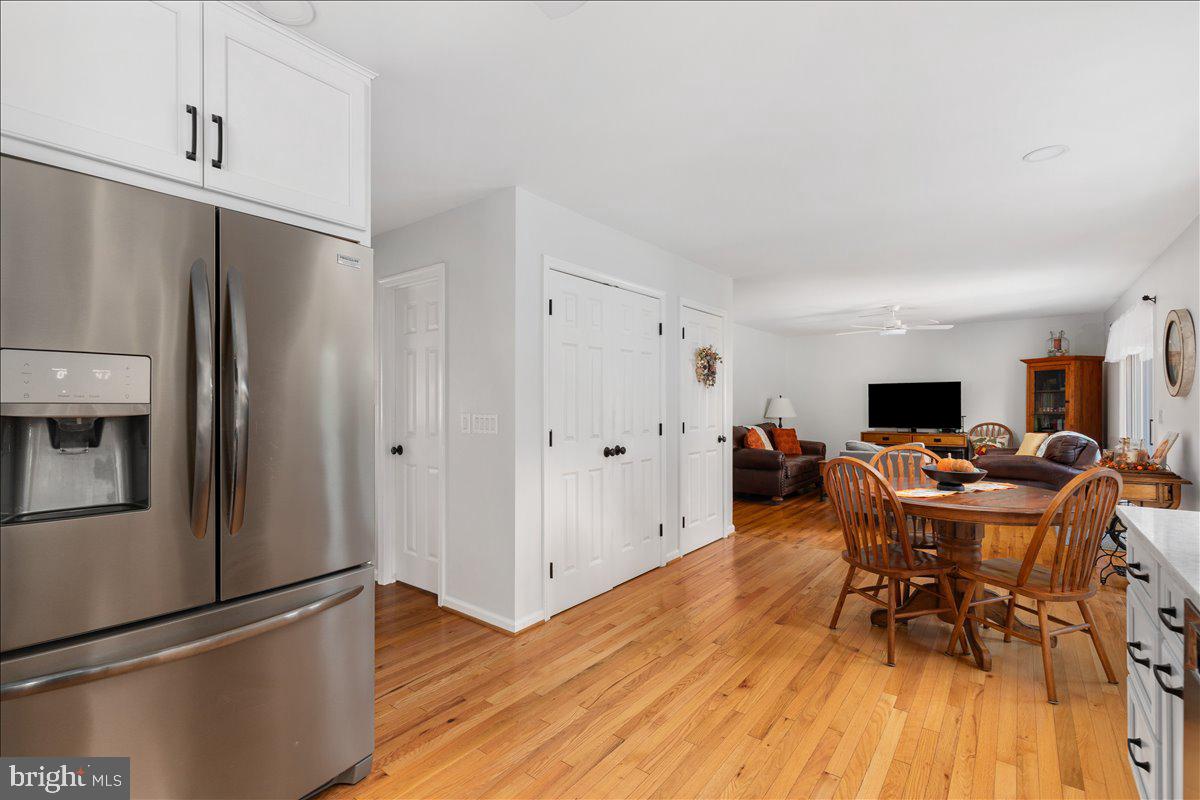 129 Old Wagon Road Winchester, VA 22602 - Photo 4 of 59 a living room with furniture a wooden floor and a sink