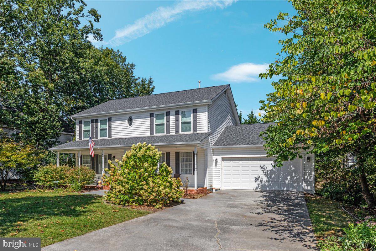 129 Old Wagon Road Winchester, VA 22602 - Photo 55 of 59 a front view of a house with a garden