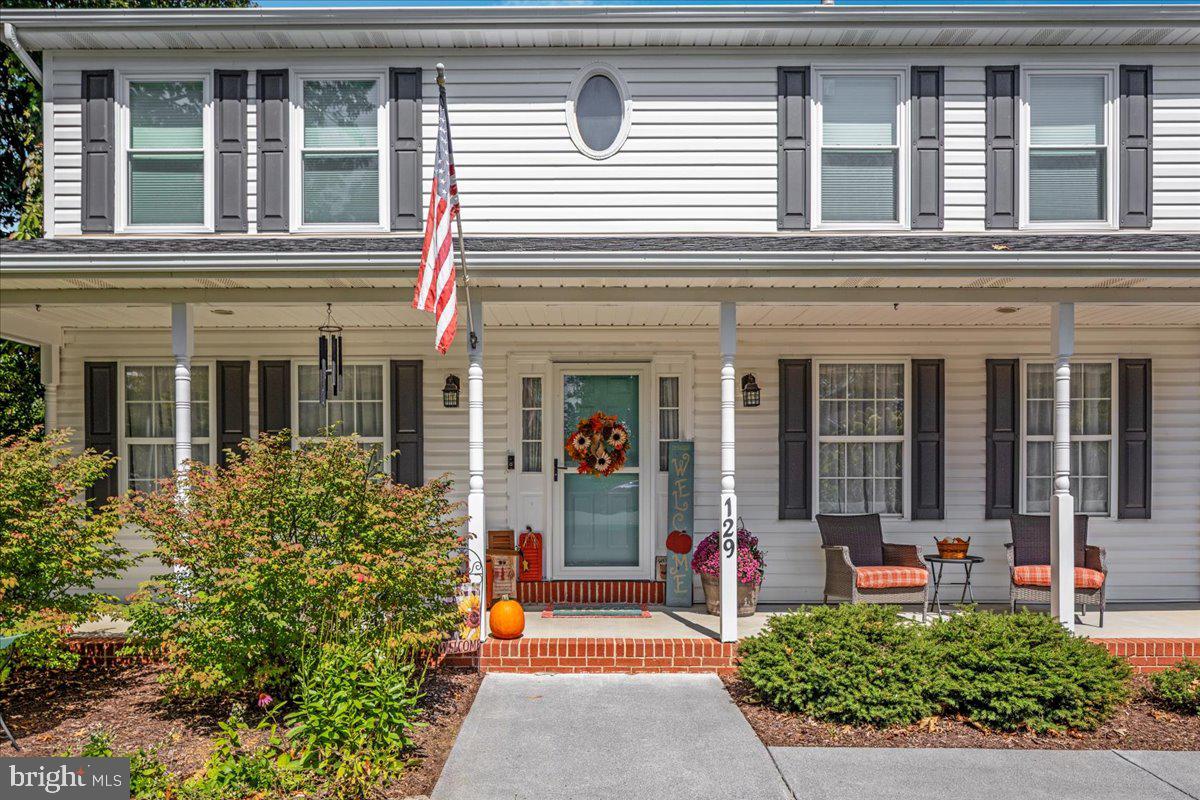 129 Old Wagon Road Winchester, VA 22602 - Photo 57 of 59 front view of a brick house with a large window
