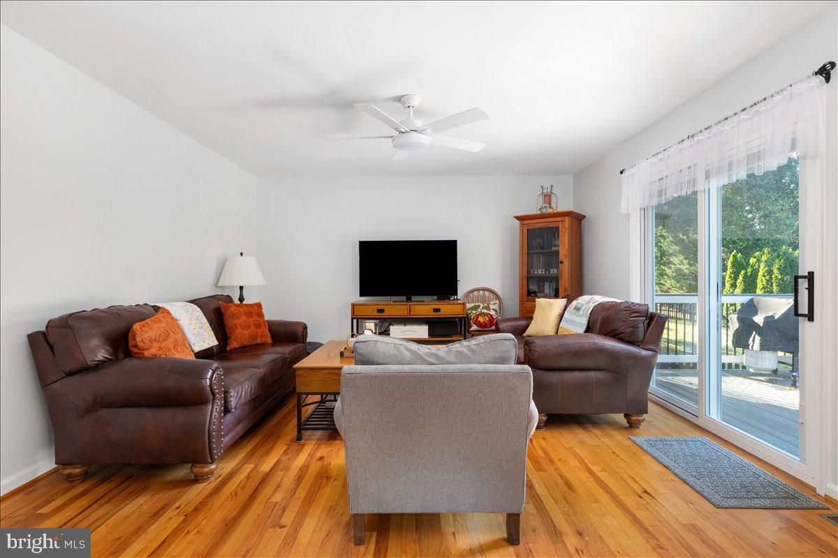 129 Old Wagon Road Winchester, VA 22602 - Photo 6 of 59 a living room with furniture and a flat screen tv