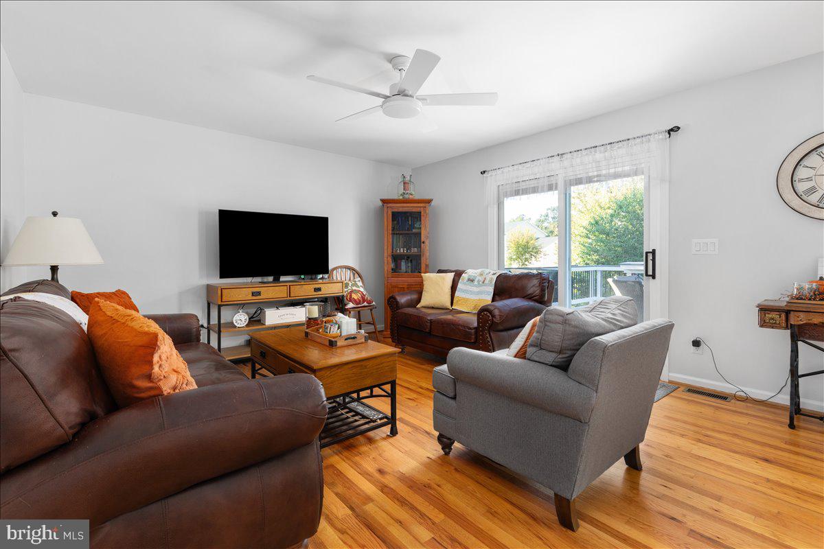 129 Old Wagon Road Winchester, VA 22602 - Photo 7 of 59 a living room with furniture and a flat screen tv
