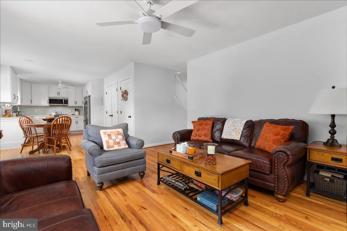 129 Old Wagon Road Winchester, VA 22602 - Photo 8 of 59 a living room with furniture a couch and a chandelier