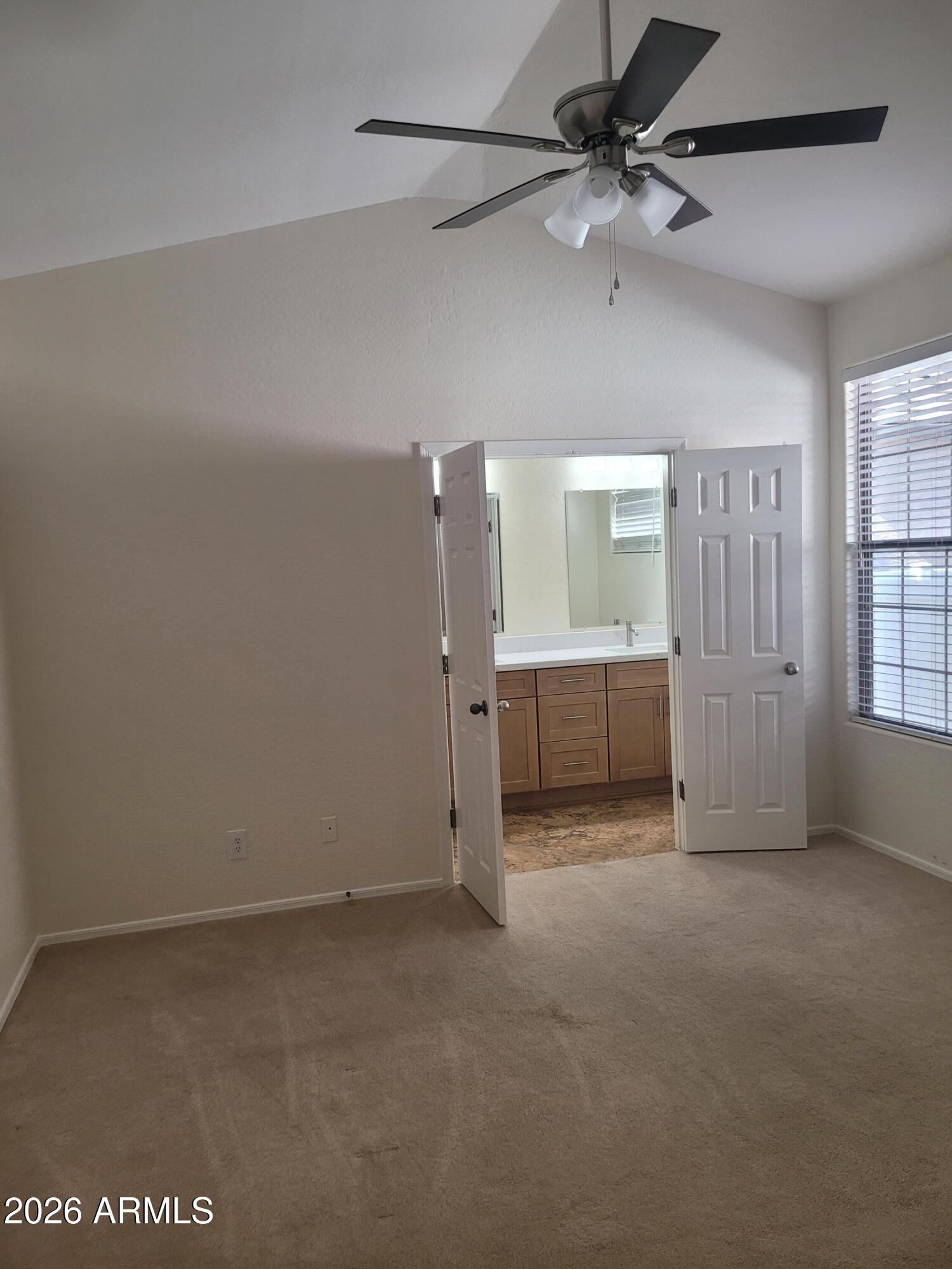1453 South Sinova Avenue Gilbert, AZ 85296 - Photo 19 of 46 en empty room with windows and ceiling fan