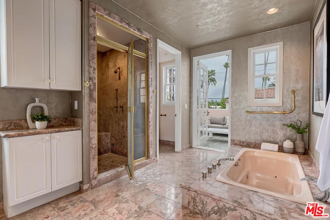 110 North Oakhurst Drive Beverly Hills, CA 90210 - Photo 17 of 29 a spacious bathroom with a tub shower and sink