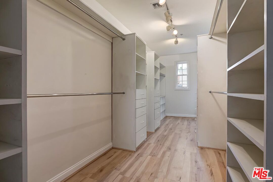 110 North Oakhurst Drive Beverly Hills, CA 90210 - Photo 19 of 29 a view of hallway with wooden floor