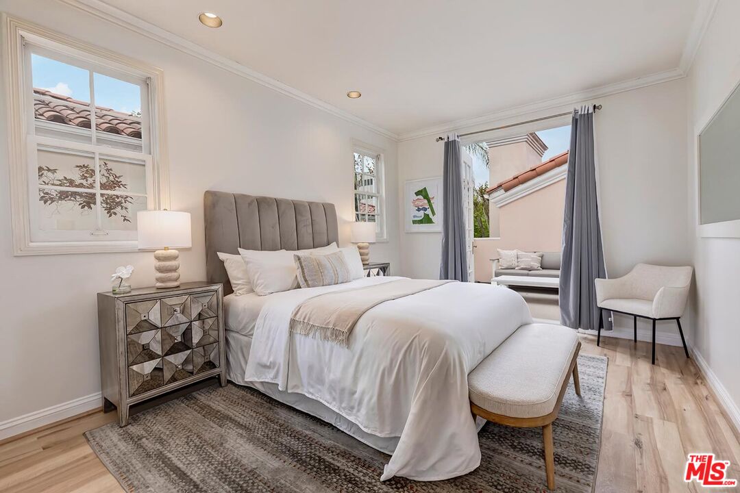 110 North Oakhurst Drive Beverly Hills, CA 90210 - Photo 22 of 29 a bed room with a bed and a chair