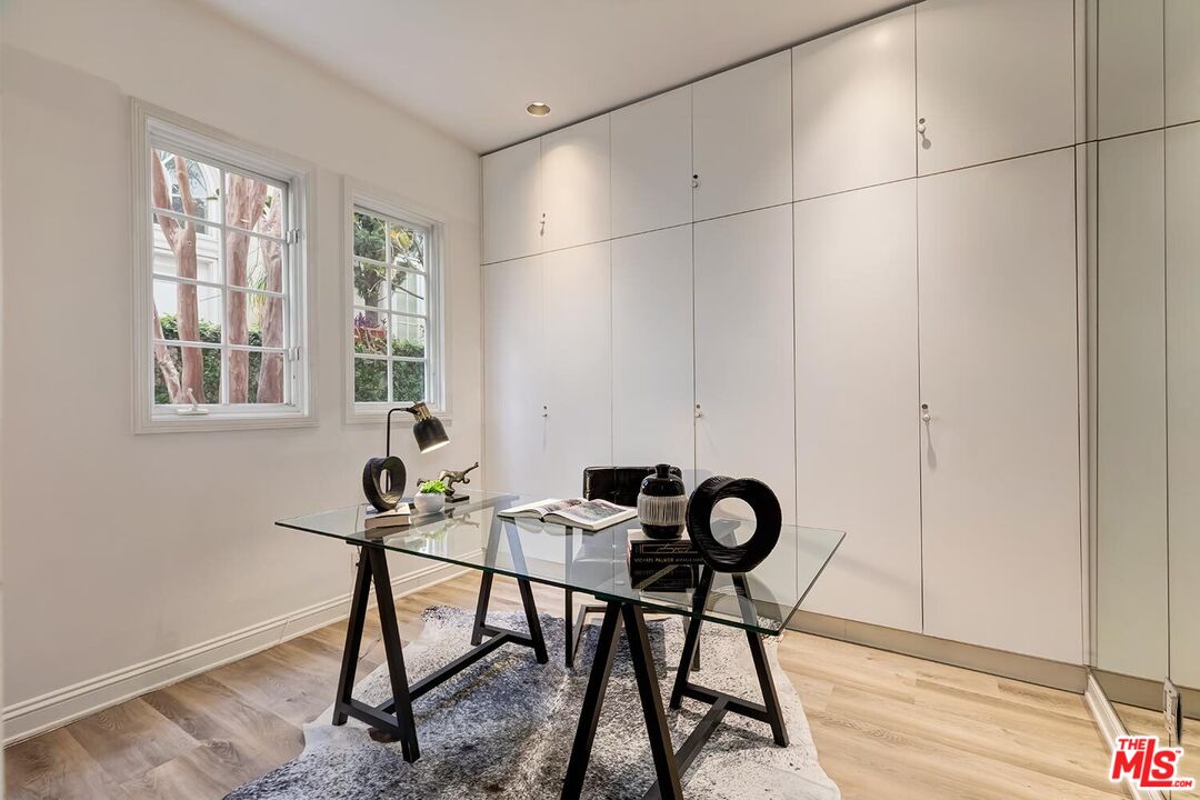 110 North Oakhurst Drive Beverly Hills, CA 90210 - Photo 26 of 29 a view of a workspace room with table and chair