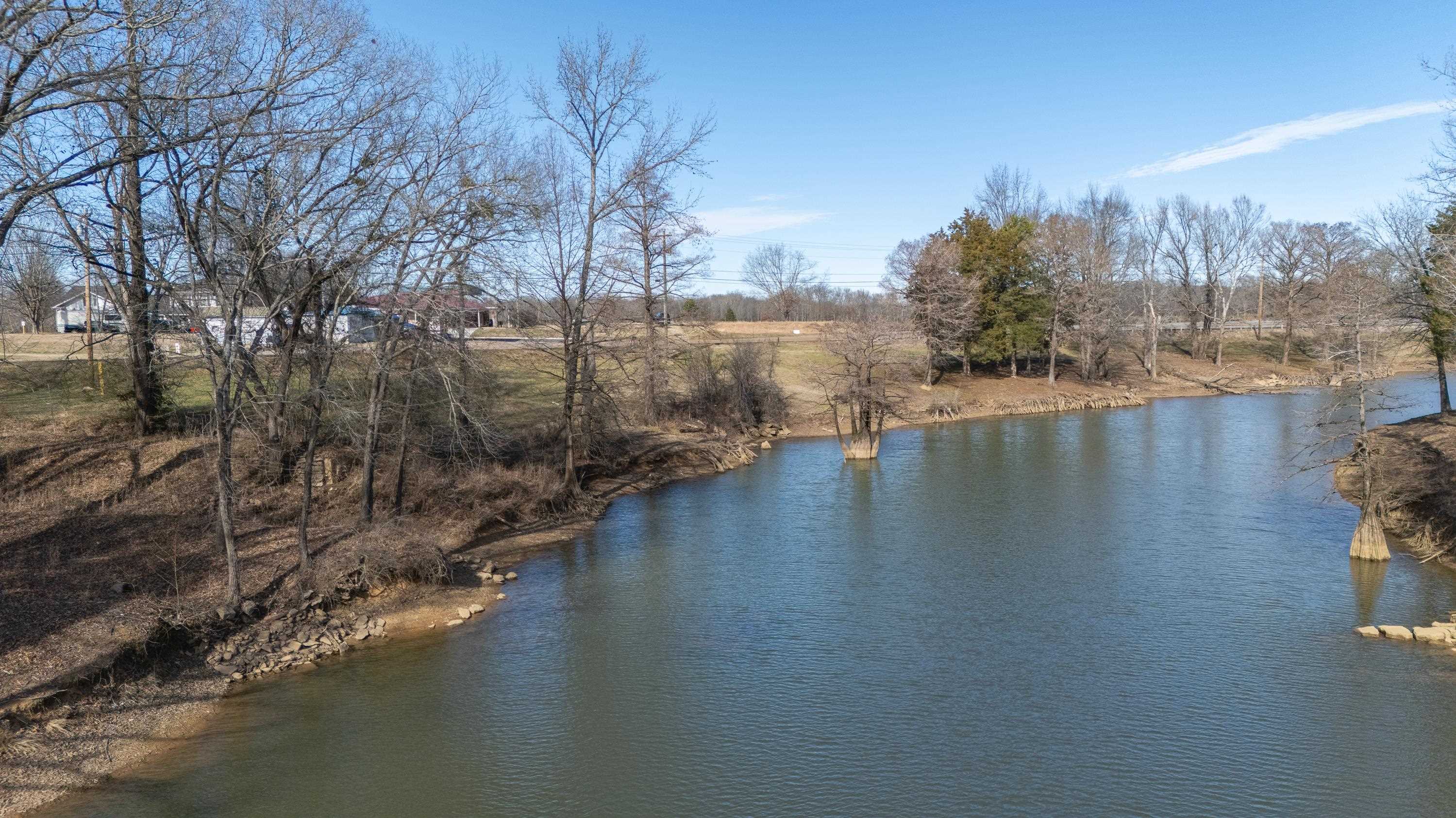 Water Street Clifton, TN 38425 - Photo 4 of 13 a view of a lake with trees in front of it